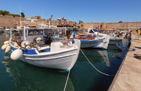 Fishing boats in Mandrak harbor on Rhodes island.の写真素材