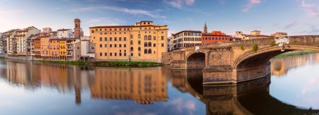 Old stone houses on the banks of the Arno river Florence early in the morning.の写真素材