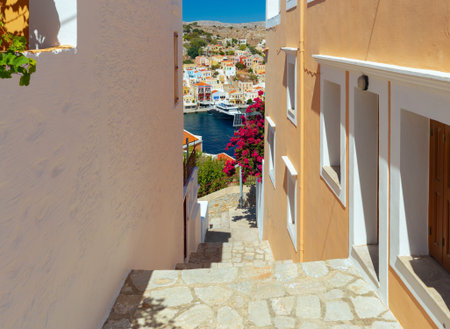 Old narrow traditional street in the Greek village of Symi.