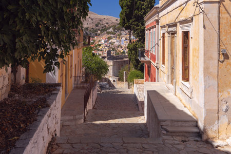 Old narrow traditional street in the Greek village of Symi.の写真素材