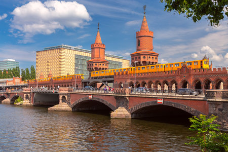 View of the old historic stone bridge Oberbaum over the Spree river in Berlin on a sunny day. Germany.の写真素材