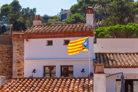Traditional Stone Houses with Tiled Roofs in Tossa de Mar, Catalonia, Spainの写真素材