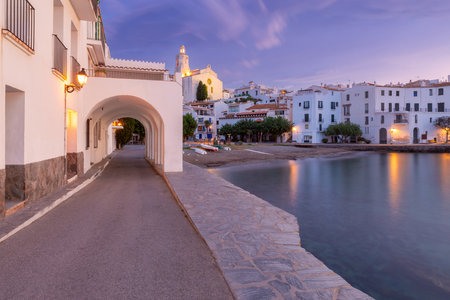 Dawn at Cadaques Waterfront with Church of Santa Maria, Catalonia, Spainの写真素材