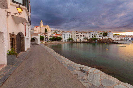 Dawn at Cadaques Waterfront with Church of Santa Maria, Catalonia, Spainの写真素材