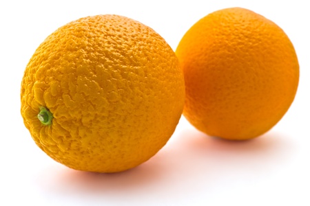 Juicy ripe oranges isolated on white backgroundの写真素材