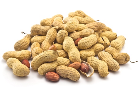 peanuts in the shell on a white backgroundの写真素材