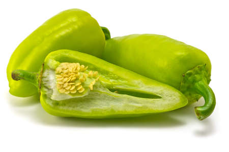 green sweet peppers on a white backgroundの写真素材