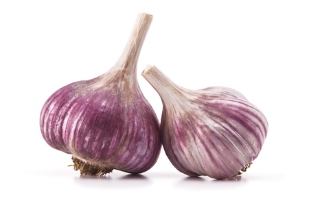 heads of garlic and garlic cloves on a white backgroundの写真素材