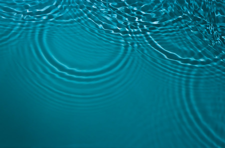 Ð¡ircles on the water surface and glare lightの写真素材