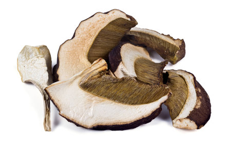 Dried slices of porcini mushrooms on a white の写真素材