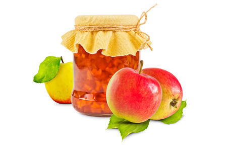 Glass jar with apple jam and three fresh apples on white backgroundの写真素材