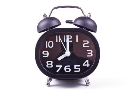 Black alarm clock with mechanical bell isolated on white background