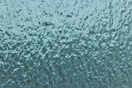Splashes of ice frozen rain on glass