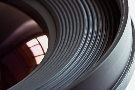 Objective lens with reflections of light sources closeupの写真素材