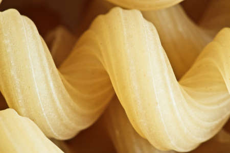 Pasta from wheat flour twisted horns closeupの写真素材