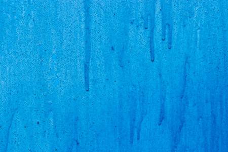 Old painted surface with paint smudges and cracks