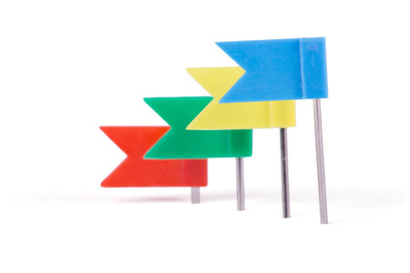 Stationery flags in different colors isolated on white backgroundの写真素材