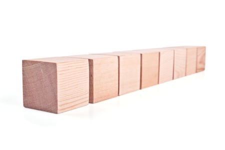 Wooden toy cubes for children's play isolated on white backgroundの写真素材