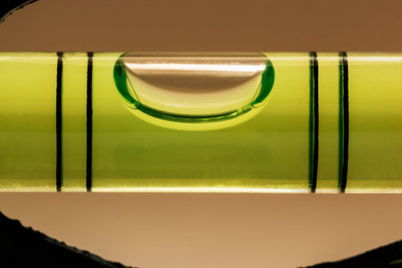 Tube with a liquid and with a bubble to measure the level of the angle of inclination of the surface