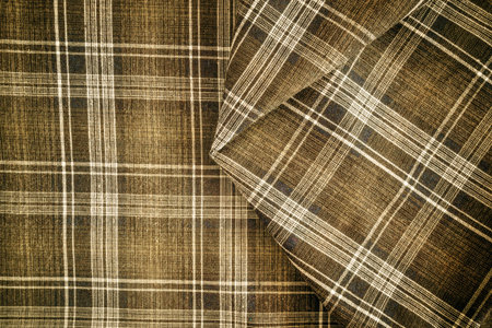 Texture of checkered fabric in brown over the entire plane of the frame