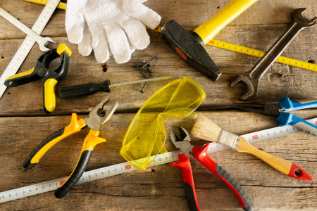 Tool for home repairs on the background of old wooden boards
