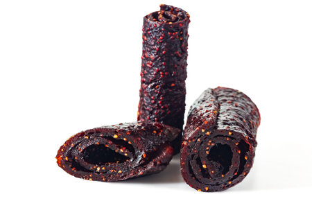 Raspberry pastille rolls on a white background