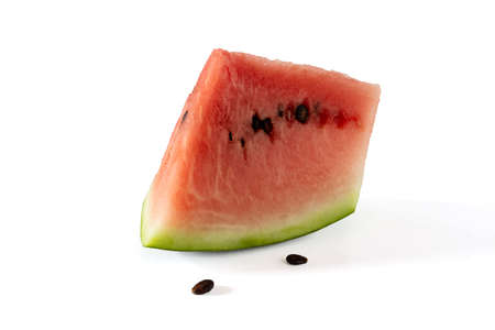 Slice of watermelon with seeds on a white backgroundの写真素材