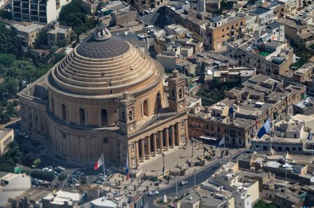 View over the Rotunda of Mosta - the Parish Church of the Assumption, Malta. Photo is taken from the airplaneの写真素材