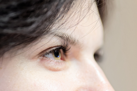 Side view of woman eye with long eyelashes - focus on eyelashesの写真素材