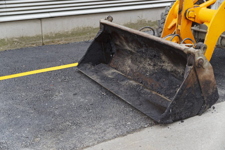 Close up of bulldozer scoop at road building. Muenster, Germany