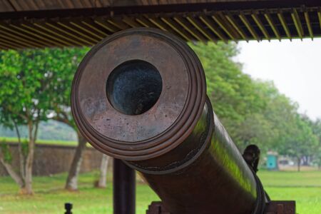 Close-up of an old antique cannon. This cannon is exhibited in a public park located near to Purple Forbidden City (Imperial City) in Hue in Central Vietnamの写真素材