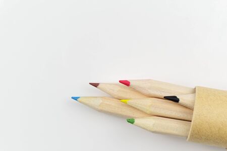 Set of colored pencils in a tube on white backgroundの写真素材