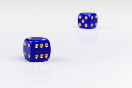 Two blue dices with gold colored points on white backgroundの写真素材