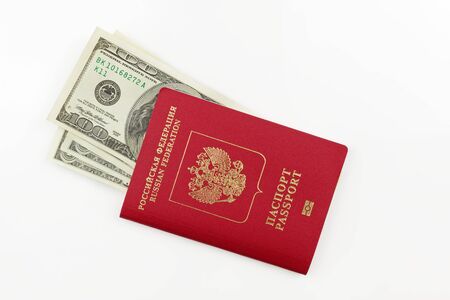 Original Russian passport and american dollars banknotes isolated on white backgroundの写真素材