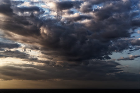 Beautiful cumulus cloud above sea during sunset
