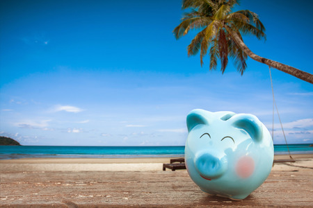 summer piggy bank on the beach.の写真素材
