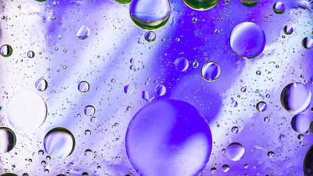 Colorful  pastel artistic image of oil drop on water for modern and creation design background.