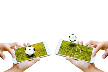 man hand hold and touch screen smartphone or cellphone isolated on white with football field on screen.の写真素材