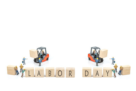 selective focus of miniature worker people working front of forklift machine with text wood labor...
