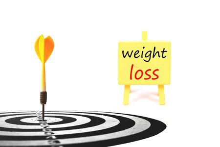 dart target with inspiration board    isolated on white back ground to solution for health and weight loss.の写真素材