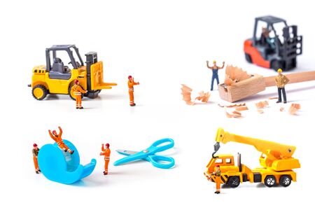 selective focus of miniature workers man with stationery isolated on white background,の写真素材