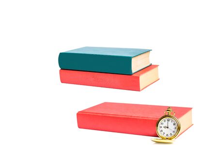vintage pocket watch over age book background.の写真素材