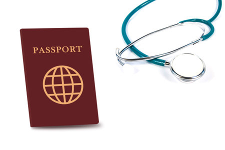 stethoscope with passport isolated on white backgroundの写真素材
