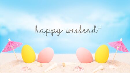 colorful eggs on white sand beach over cloudy sky,happy Easter holiday or happy weekend concept.の写真素材