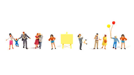 miniature people on white background.の写真素材
