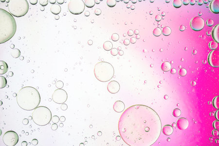 artistic image of oil drop on water for modern and creation design background.
