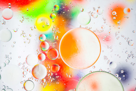 artistic image of oil drop on water for modern and creation design background.