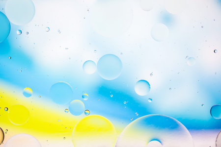 artistic image of oil drop on water for modern and creation design background.