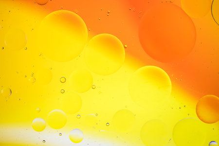 artistic image of oil drop on water for modern and creation design background.