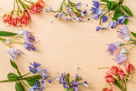 frame of satin flower on wood background.